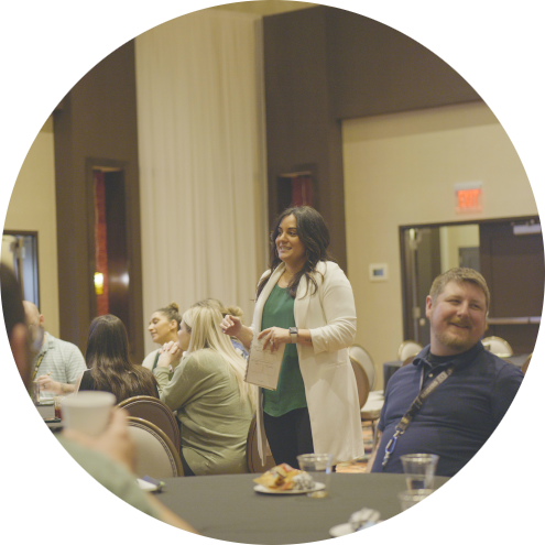 woman talking at a conference